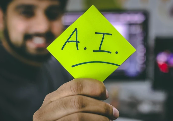 Person holding up a highlighter yellow paper with the words "A.I." on it.