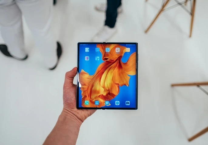 Huawei foldable smartphone Mate Xs with a colourful screen background.