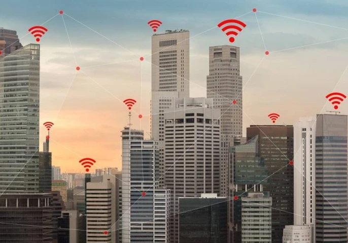 Skyscrapers in a city with WiFi connectivity symbol above each building