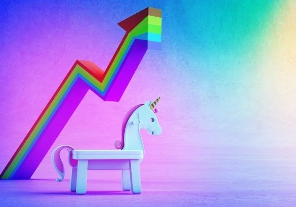 Unicorn in front of a rainbow graph showing a dramatic upward trajectory