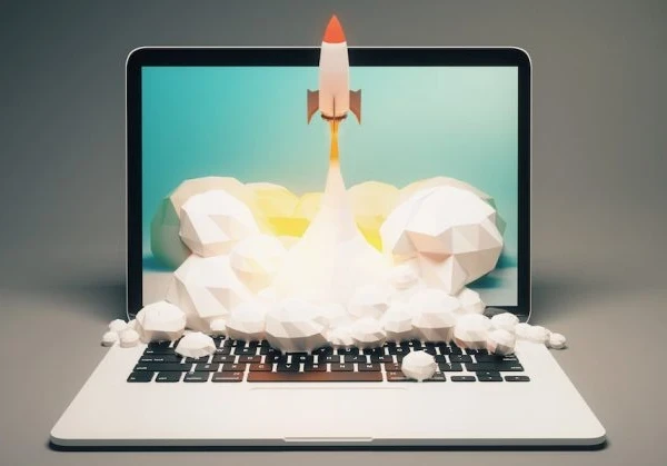 A rocket launching from a laptop