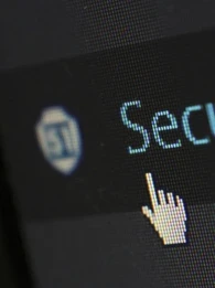 cybersecurity on a screen with mouse icon hovering over 