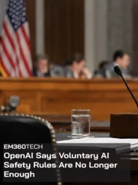 EM360Tech header graphic with the headline &ldquo;OpenAI Says Voluntary AI Safety Rules Are No Longer Enough&rdquo; in white text over a dark translucent panel. Background shows a blurred US congressional hearing room with an American flag, officials, a witness microphone, laptop and documents. 