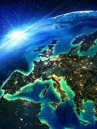 Image of the world with the rising sun in the background and the focus on Europe lighting up