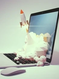 drawing of a rocket launching from a laptop