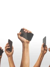 Hands holding up smartphones