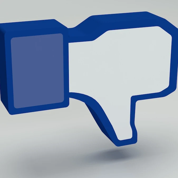 Reaction emoji showing a thumbs down in Meta's Facebook branding