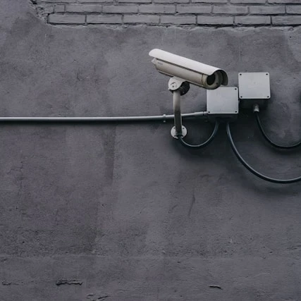 https://unsplash.com/photos/two-bullet-surveillance-cameras-attached-on-wall-yekGLpc3vro?utm_content=creditShareLink&utm_medium=referral&utm_source=unsplash
