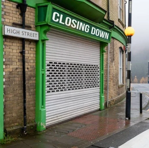 shopfront with a closing down sign