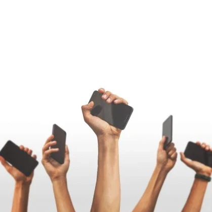 Hands holding up smartphones