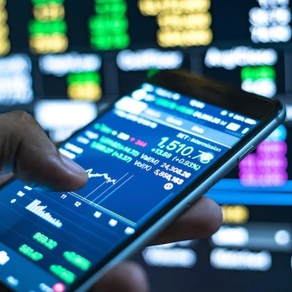 Person using a smartphone to check market prices and stocks