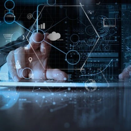 Person typing on a keyboard with a touchscreen in front of them with data points that they're tapping